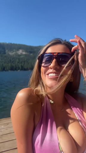 Curvy blonde adult performs in bikini at lake on TikTok - non-nude