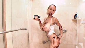 Watch Paris Milan spread chocolate all over her body while showering solo