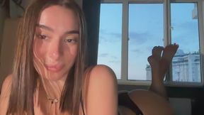 A gorgeous Russian college girl fingers her pussy