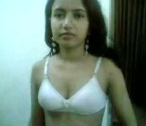 Pretty Indian teeny with perky tits strips for me exposing her shaved pussy