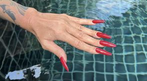 Long RED nails and long fingers in swimming pool