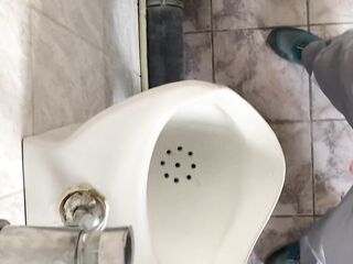 Peeing in a public water closet view from the eyes