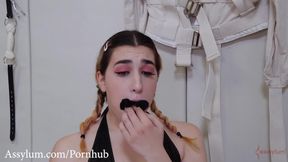 Young submissive worships boots and feet in BDSM scene with Lexi Grey