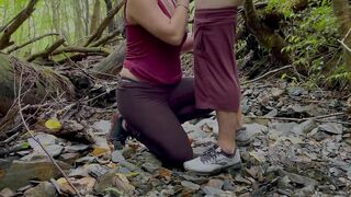 Lovers having sex into the forest while hiking