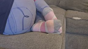 Chrissy laying on couch in puma socks pt 2