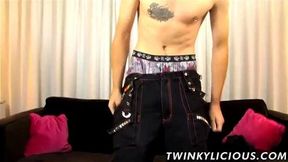 Twink with tats jerks off solo and smiles while he does it