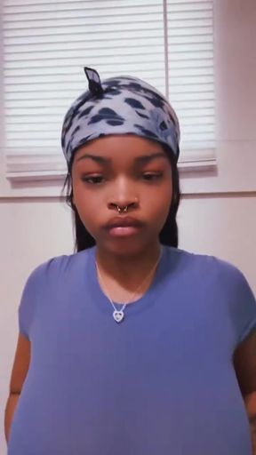 Woman in blue shirt and bandana