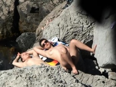 Beach voyeur finds a lovely amateur babe enjoying the sun