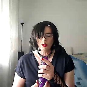 horny MILF tranny simulates giving her partner a Blowjob on webcam while playing with a vibrator in her mouth