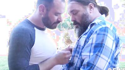 Two chubby bears with beards fuck hard outdoors after blowjobs