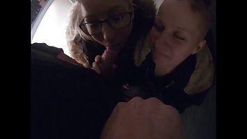 Two babes sucking dick in the chainging room