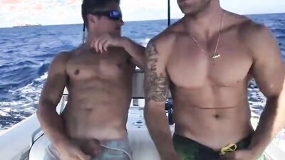 Dudes are sucking each other's cock and bareback on the boat