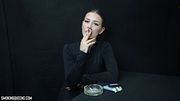 [7] Lesya is smoking all-white superslim Vogue cigarette, sometimes smoking hands-free (dangling), flicking the ash into the ashtray | 4K Resolution