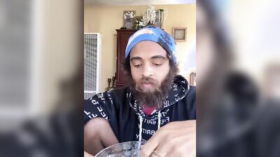 Cute guy with a sexy beard has fun reviewing food