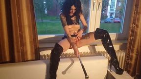 whore fucks herself with a baseball bat at the window for the neighbours