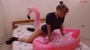 Alla blows off an inflatable flamingo sexy and wears a latex mini dress with big boobs!!!