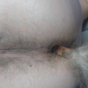 Tail plugged deep into hairy asshole