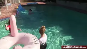 Four alluring babes strip and play with lucky guy in a pool