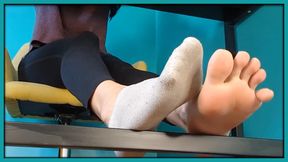 Under your roommate’s desk, staring at her feet