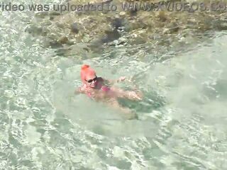 Pink bikini in a beautiful bay