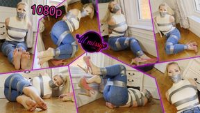 Taped up damsel on the floor in jeans 1080p