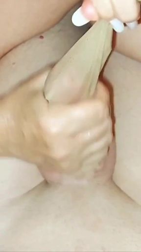 Thrilling moment from "Mother-in-law wears nylon socks and rubs my dick with her feet until I cum on her foot"