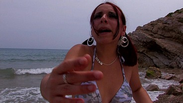 Crazy spanish girl fucks a tourist sunbathing on the beach