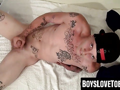 Tattooed skater sports hard cock and big feet