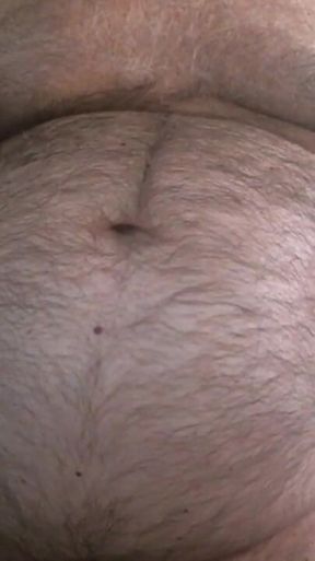 Coach Karl Shows off His Furry Belly