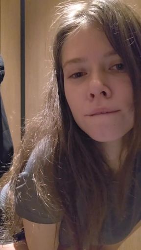 Charming girl teases you very quietly in a public toilet