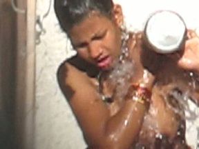 Hot and chunky seductive Indian lady open air showering