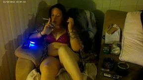 Hot Mom smoking cigarettes while playing video games in her purple bra and