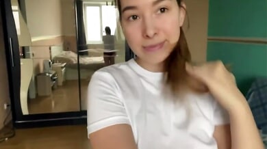 Young woman in red lace panties touches herself on camera