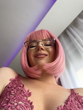 Pink wigged woman in glasses