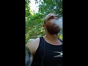 muscular bodybuilder walking and masturbate outside