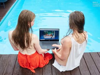 Girlfriends enjoy swimming naked together