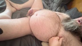 Hairy uncut bear on his back