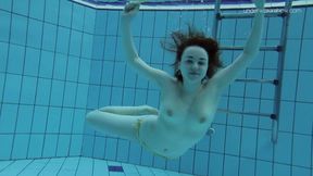 Shaved beauty Lada Poleshuk shows off large knockers underwater