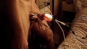 Inflated foreskin illuminated, pierced needles , pins balls