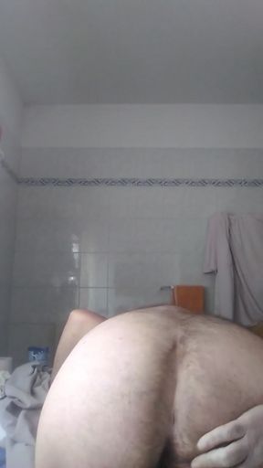 Davide the pig is in the bathroom, he undresses, he pees in a cut plastic bottle and I show his beautiful big ass.   Clip 1