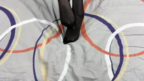 This sexy girl loves rubbing her legs in black nylon pantyhose in gentle solo video with caresses