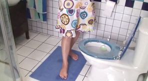 Toenails painting on toilet seat