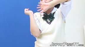 Two cute Japanese girls laugh and smile while peeing on camera