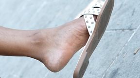 Unposing foot fetish close-up, candid slippers dangling, hot feet and soles.