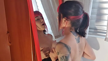 Alt girl sinking pussy into the dildo stuck to the mirror