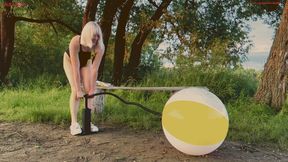 Alla pumps a new beach ball and it bursts loudly