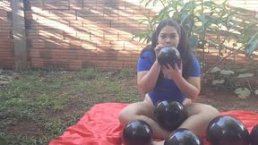 Inflating and popping balloons outdoors
