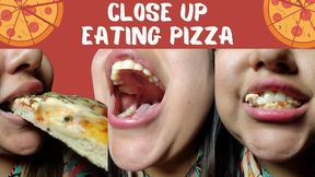 Close up eating pizza