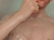 Skinny teen takes a bath and uses shampoo to wash himself
