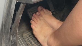 Bbw with big feet barefoot pressing car pedals and peeling off brake pad cover with toes